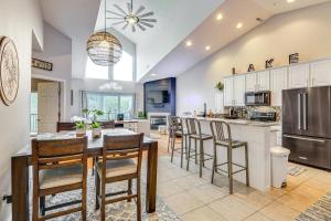 a large kitchen with a table and chairs at Camdenton Condo with Patio, Pool and Lake Access! in Camdenton