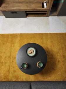 a black table with two bowls of food on it at Apartment Boras in Vir