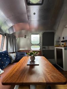 a table in the middle of a living room at Airstream Experience in Knutsford