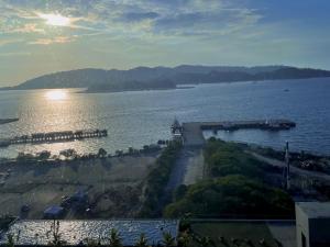 a view of a large body of water at SUNSET JESSELTON QUAY NEAR SURIA GAYA STREET Jesselton Point in Kota Kinabalu