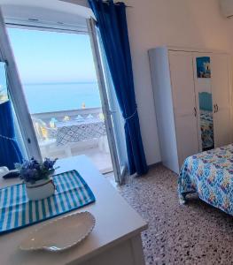 a hotel room with a view of the ocean at Casa del Mare in Ischia