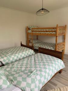 a bedroom with two bunk beds at La maison du lavoir in Fain-lès-Montbard
