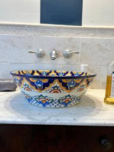 a colorful sink on a counter in a bathroom at Vintage Charm: Annapolis Retreat in Annapolis