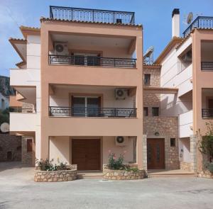a large building with two balconies on top of it at Sophie's Sunny Spot 2 in Yéfira