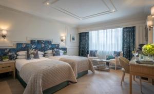 A bed or beds in a room at The Brehon Hotel & Spa