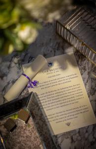 a book and a toothbrush sitting on top of a table at The Brehon Hotel & Spa in Killarney