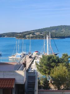 a marina with boats docked in the water at nautic world studio in Tisno