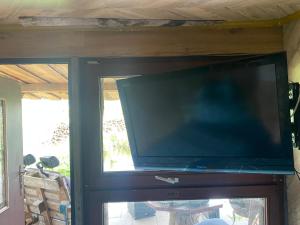 a large flat screen tv sitting on top of a door at Auszeit inmitten der Natur - its a kind of magic in Freienthal