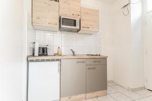 Eldhús eða eldhúskrókur á City Vibes: 1BR Apt, 10 Min to Westbahnhof