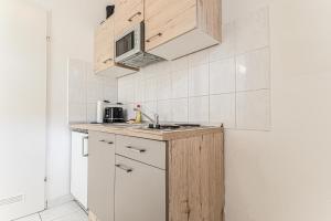 Eldhús eða eldhúskrókur á City Vibes: 1BR Apt, 10 Min to Westbahnhof