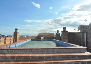 a swimming pool on the roof of a house at RNET-Nautilus Roses Costa Brava in Roses