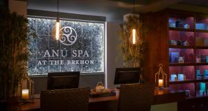 a salon with a sign in a window with chairs at The Brehon Hotel & Spa in Killarney