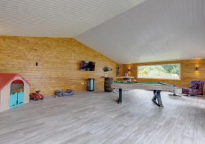 a large room with a ping pong table in it at Wensum Retreat 