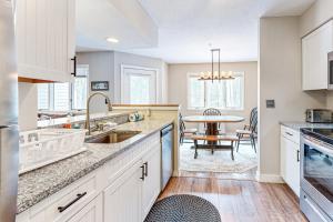 a kitchen with a sink and a table at Vantage Point #8 in Stratton