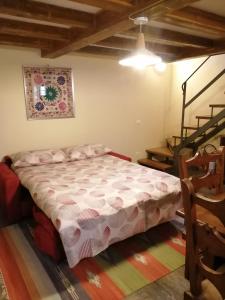 a bedroom with a bed in a room at CASA INES in Stresa