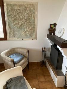 a living room with a couch and a fireplace at Grand chalet familial in Forest-Saint-Julien