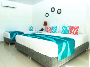 Hotel Caribbean Coral客房内的一张或多张床位