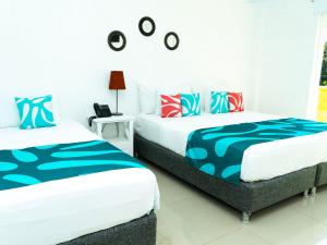 Hotel Caribbean Coral客房内的一张或多张床位