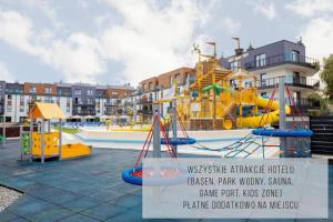 a water park with a slide and a playground at HOLIDAY HOME Bel Mare 522F z balkonem in Międzyzdroje