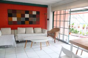 a living room with a couch and a table at CasaSanTelmo 2984 in Buenos Aires