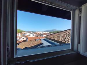 a view from a window of a roof at Fargeot in Saint-Jean-de-Luz