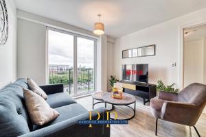 a living room with a couch and a table at The Middlewood Plaza Suite - By Parydise Properties - Business or Leisure stays, Central Location, Sleeps 4, Salford in Manchester