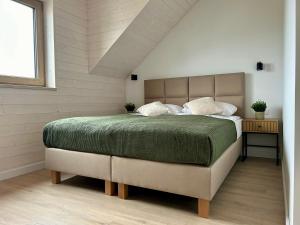 Postel nebo postele na pokoji v ubytování House Natura