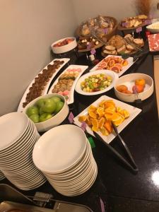 a table topped with plates and bowls of food at CK Farabi Hotel in Ankara