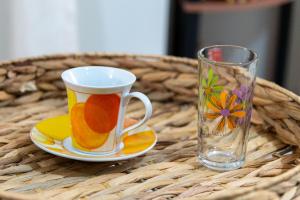 a coffee cup and a glass on a table at 50 DANAIDES in Argos +21 photos