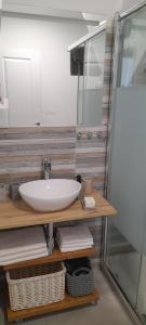 a bathroom with a sink and a mirror at Barbeito in Sanxenxo