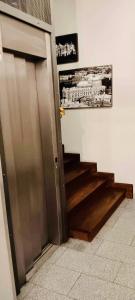 a hallway with a door and stairs in a room at Old Town Gertrudy Apartment - Topolove Rooms & Apartments in Krakow