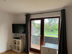 a sliding glass door with a view of a balcony at Henriette 1 in Walkenried