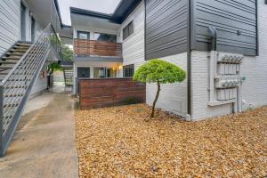 a house with a tree in the front yard at Dallas Apartment with Pool Access, 10 Mi to Downtown in Dallas