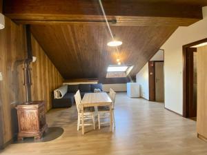 a living room with a table and chairs and a couch at ApartVilla Trieste in Trieste