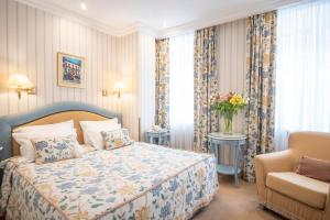 Postel nebo postele na pokoji v ubytování Swiss Hotel
