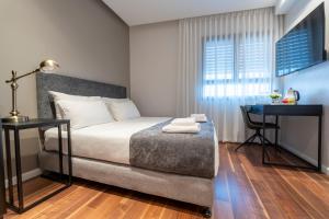 Letto o letti in una camera di Hematian Hotel by Effy