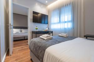 Postel nebo postele na pokoji v ubytování Hematian Hotel by Effy