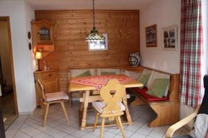 a small dining room with a table and chairs at Ferienhaus Alpkönigin in Missen mit Garten und Terrasse in Missen-Wilhams