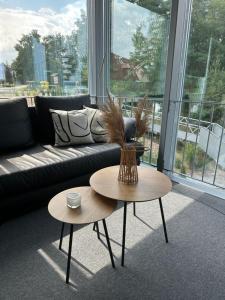 a living room with a couch and a coffee table at Appartment Düne 10 2OG Grundbelegung 2 Pers in Elsterheide