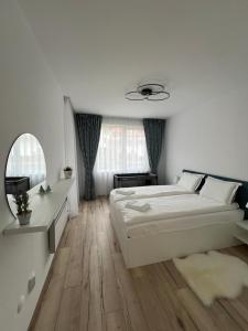 Postel nebo postele na pokoji v ubytování MidnightBlue Apartment + 30 fotografií