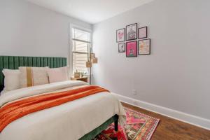 a white bedroom with a bed and a window at Princeton Gem - Walk Everywhere! in Princeton