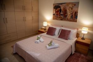 Giường trong phòng chung tại Villa Olivo
