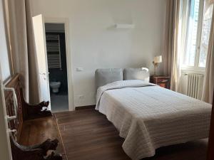 Postel nebo postele na pokoji v ubytování Residenza Scaligera