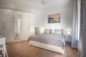Postel nebo postele na pokoji v ubytování Apartment Klara + 18 fotografií