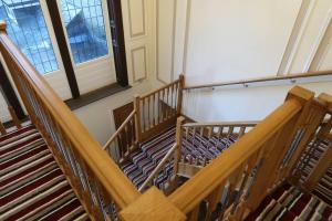 an overhead view of a staircase in a church at Two-Bedroom Apartment with Scenic Balcony View in Shipley +8 photos