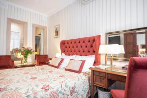 Postel nebo postele na pokoji v ubytování Swiss Hotel