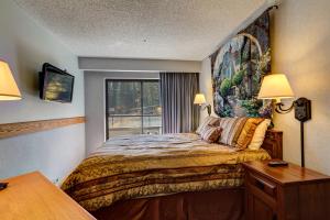 A bed or beds in a room at Beaver Run Resort 4237 by Great Western Lodging