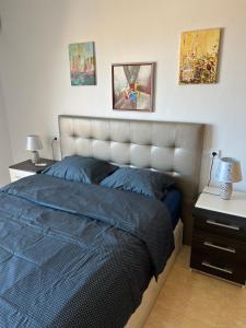 A bed or beds in a room at First Line Cabo Roig Orihuela Costa