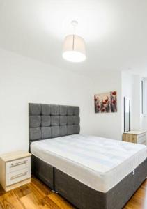a bedroom with a large bed in a room at City Centre Rooms in Cardiff