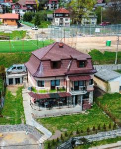 an aerial view of a house with a roof at Casa Forrás in Borsec